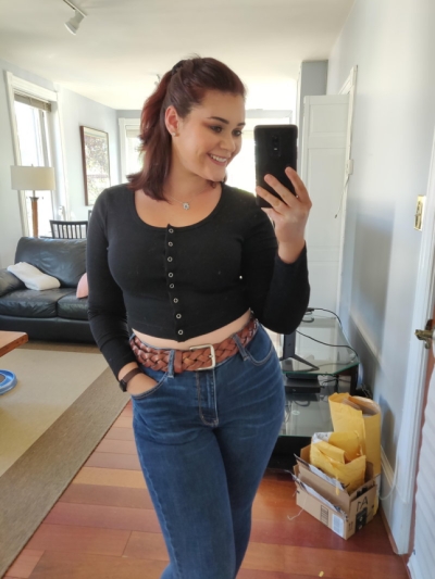 A lush girl makes a selfie photo demonstrating her mouth -watering body