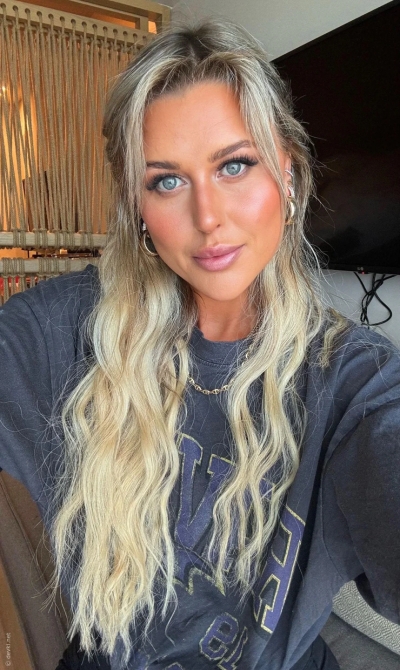 Cute woman shows her naked tanned body