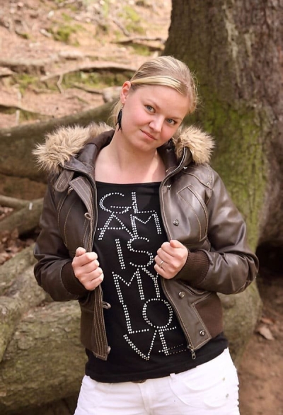 Girl undresses in the forest