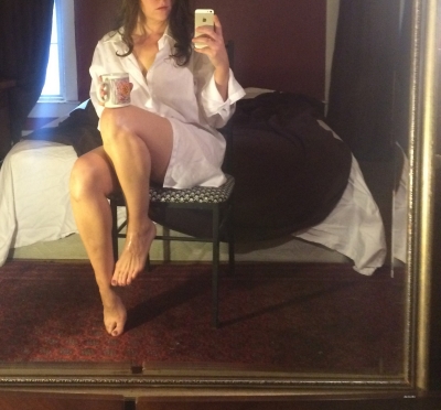 Pretty girl takes a photo of herself on her phone