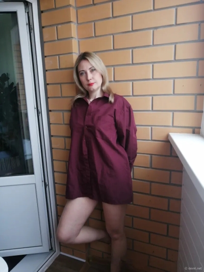 Milf shows her tits at the window