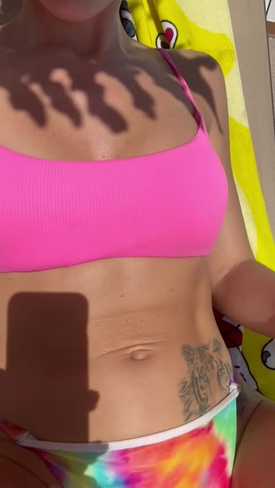 Tanned blonde shows off hairy pussy